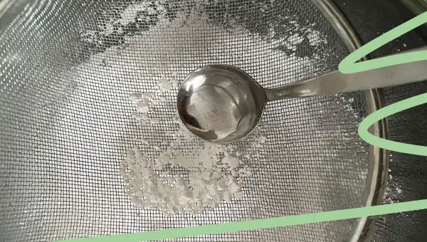 sieving powdered sugar