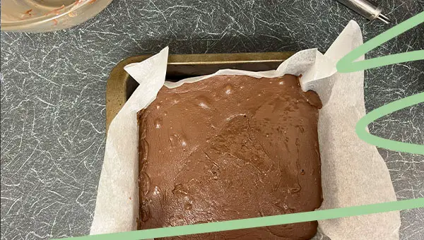pour chocolate fudge mixture into tin