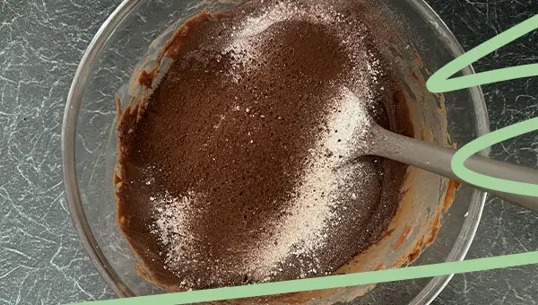 sift cocoa powder and powdered sugar into chocolate fudge mixture